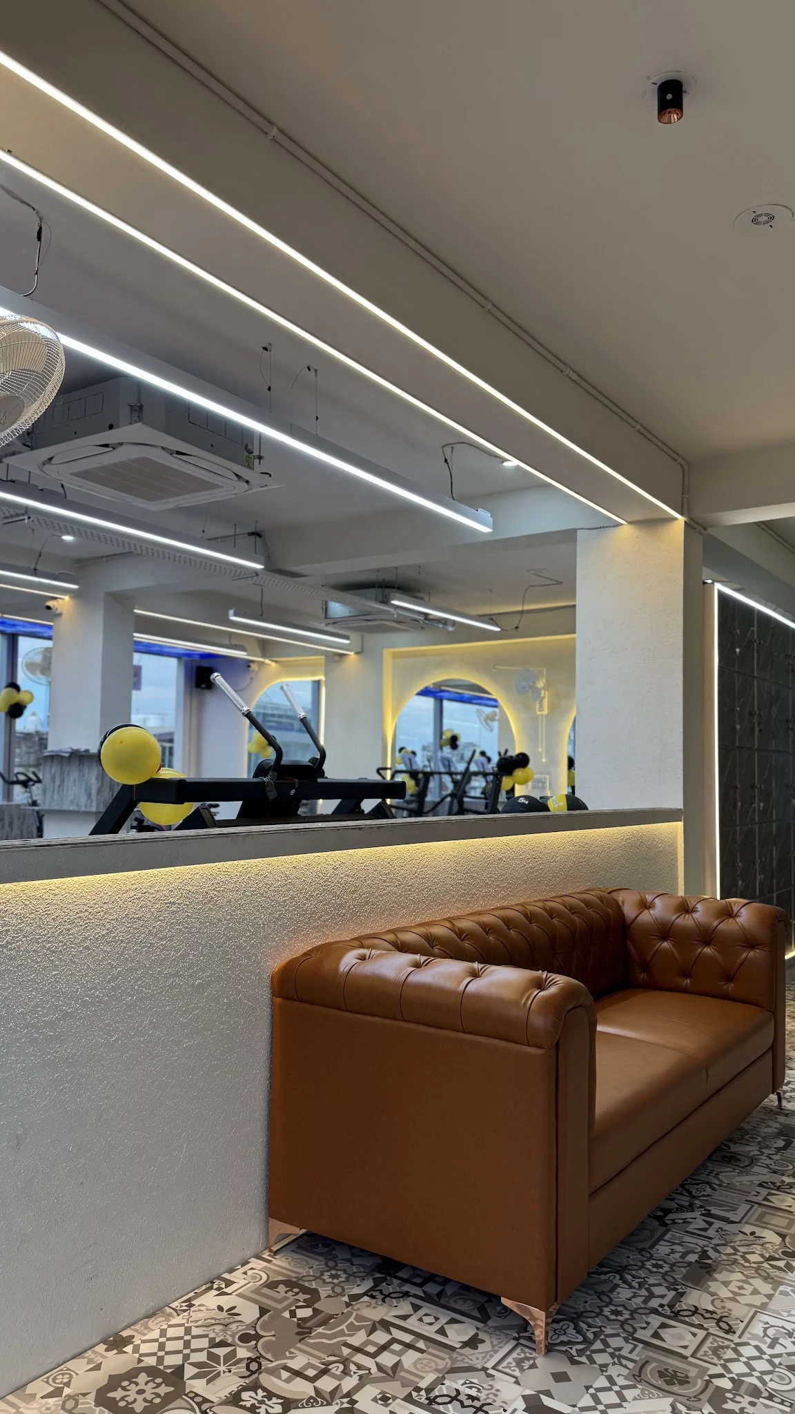 Warm leather seating in the gym lounge