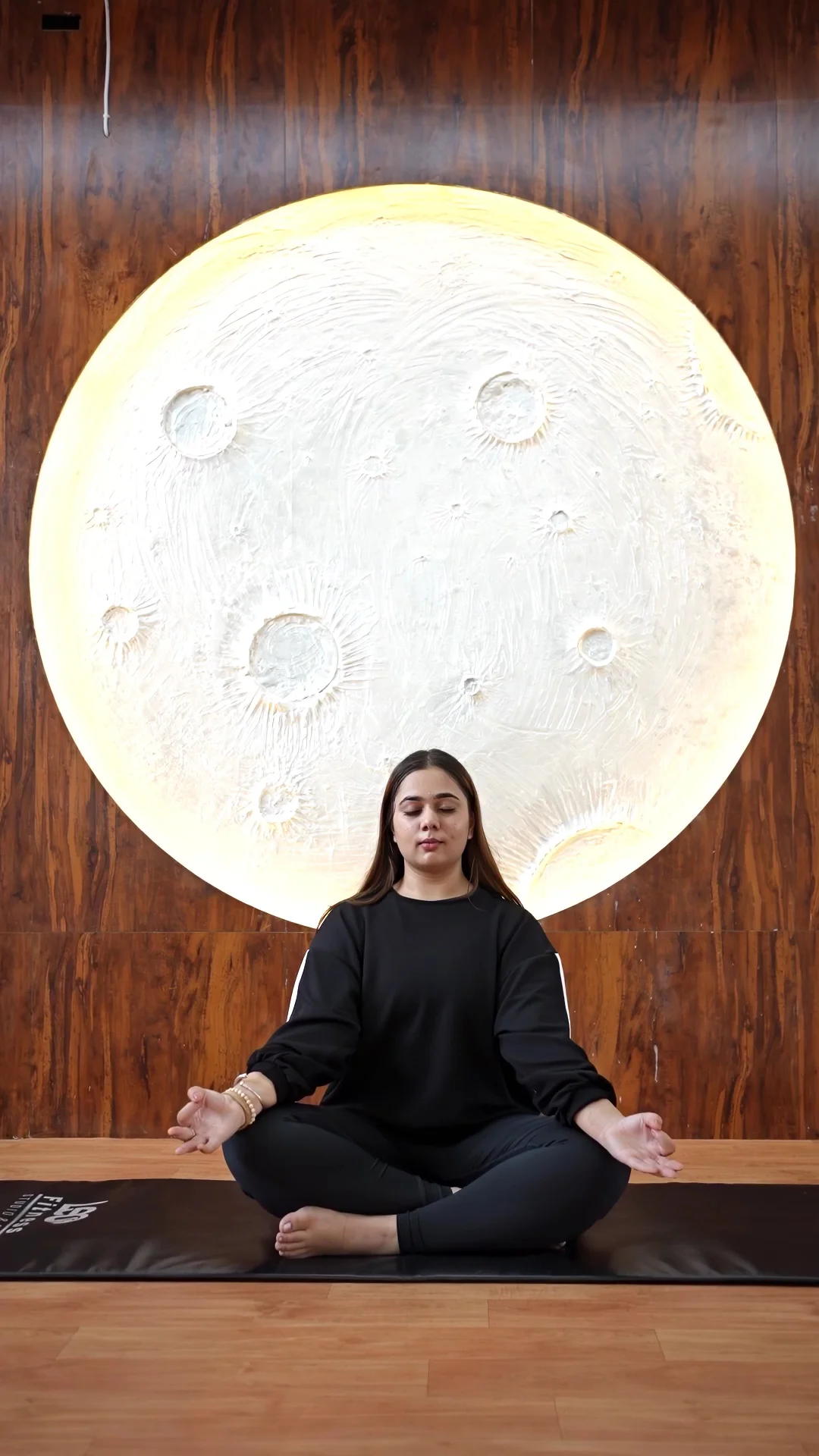 Seated yoga practice in the moon studio